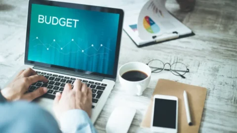 A man performing budget management on his laptop during Xero Training. - JacRox