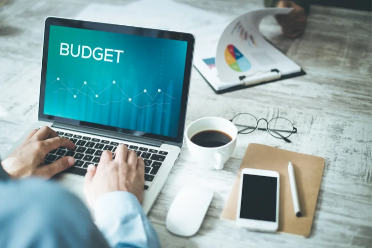 A man performing budget management on his laptop during Xero Training. - JacRox