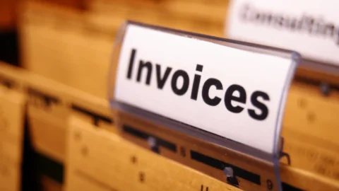 A stack of repeating invoices in a filing cabinet. - JacRox