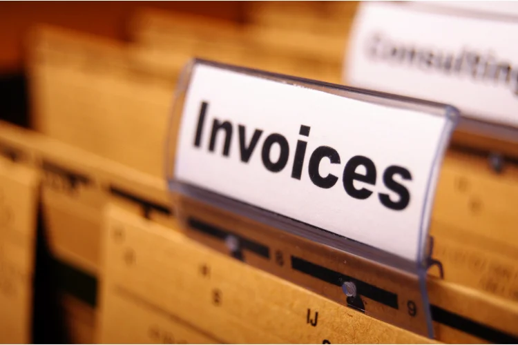 A stack of repeating invoices in a filing cabinet. - JacRox