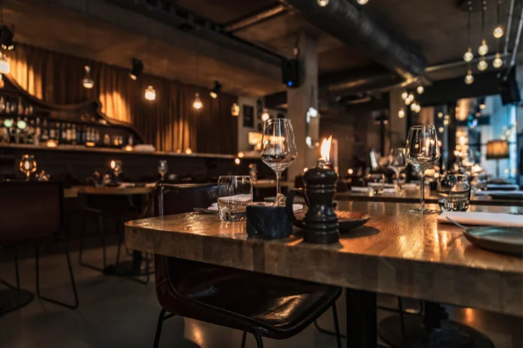 A restaurant with wooden tables - JacRox