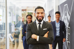 Businesspeople smiling in a brightly lit office