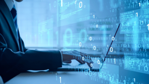 A businessman working on a laptop - JacRox