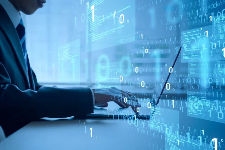 A businessman working on a laptop - JacRox