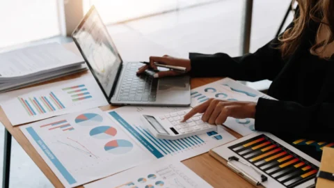 Business professional using Xero bookkeeping software on a laptop